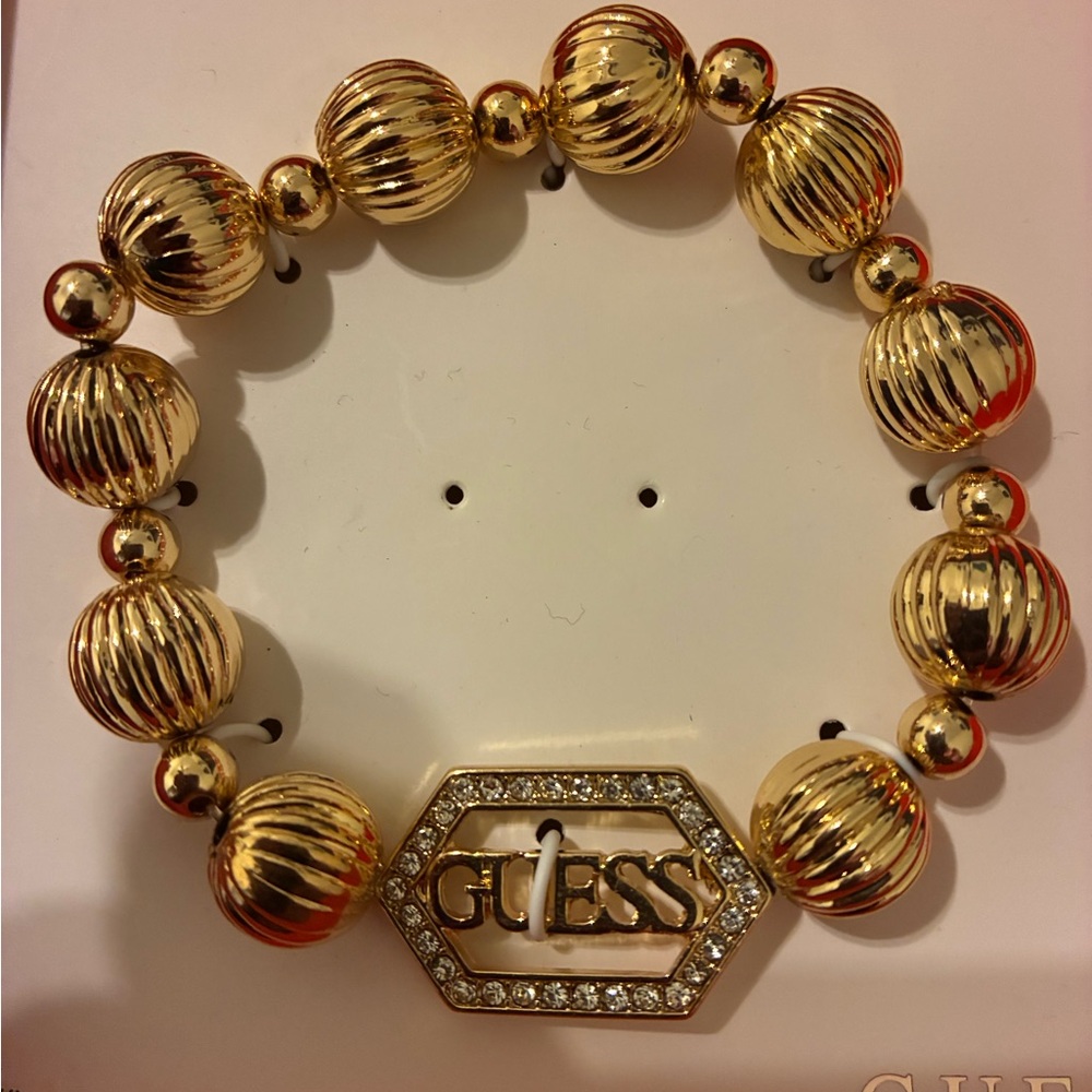 GUESS Gold-Tone Bracelet with Crystal Logo - Picture 3 of 4